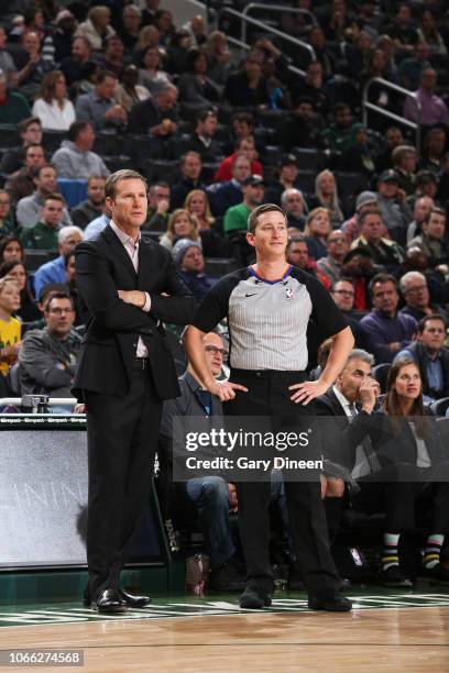 Head Coach Fred Hoiberg of the Chicago Bulls and Referee official Nick Buchert and look on during the game on November 28, 2018 at the United Center...