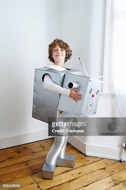 portrait of boy dressed as a robot - robot costume stock-fotos und bilder