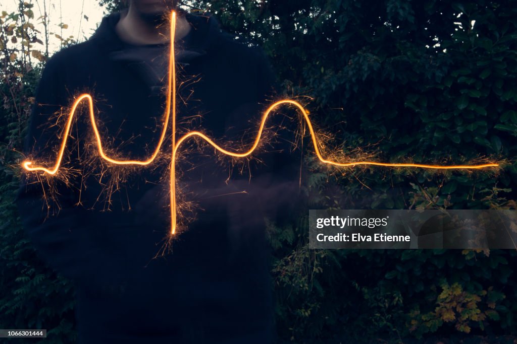 Long exposure of sparkler used to draw out a normal heart rhythm