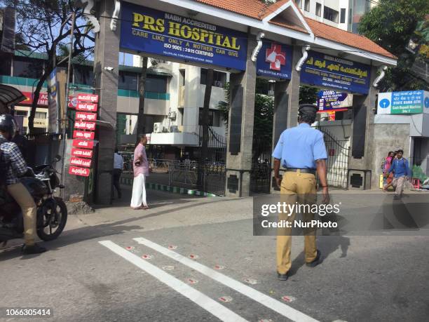 Security guard patrols the front gate of the PRS Hospital in the city of Thiruvananthapuram , Kerala, India, on July 20, 2018.