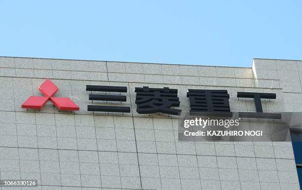 The logo of Japan's Mitsubishi Heavy Industries Ltd. Is displayed on the company's headquarters in Tokyo on November 29, 2018. - South Korea's top...