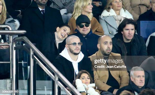 Leonardo DiCaprio and his girlfriend Camila Morrone, below DJ Snake attend the UEFA Champions League Group C match between Paris Saint-Germain and...