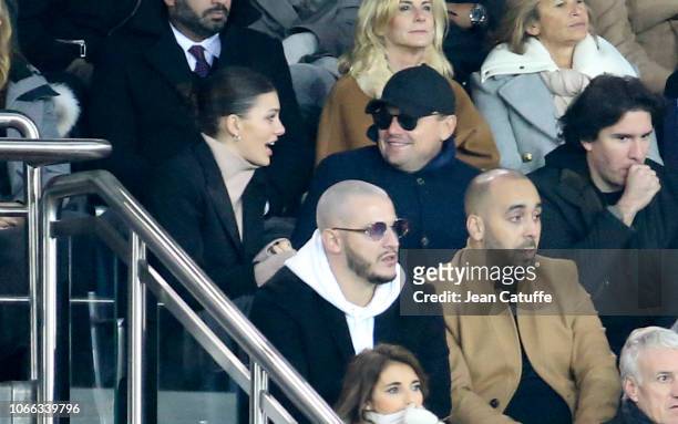 Leonardo DiCaprio and his girlfriend Camila Morrone, below DJ Snake attend the UEFA Champions League Group C match between Paris Saint-Germain and...