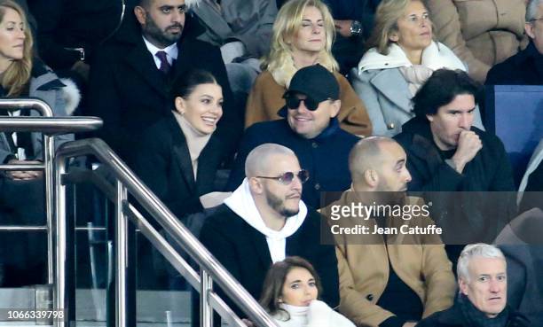 Leonardo DiCaprio and his girlfriend Camila Morrone, below DJ Snake attend the UEFA Champions League Group C match between Paris Saint-Germain and...
