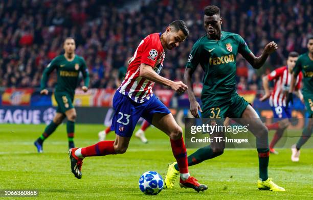 Vitolo of Atletico de Madrid and Benoit Badiashile Mukinayi of Monaco battle for the ball during the Group A match of the UEFA Champions League...