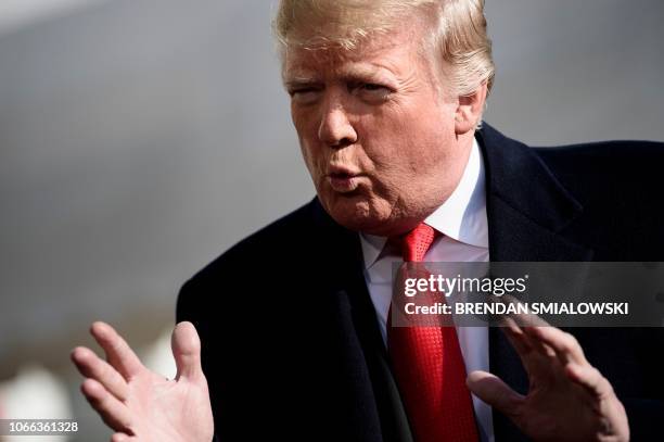 President Donald Trump speaks to reporters while walking to Marine One on the South Lawn of the White House November 29, 2018 in Washington, DC. -...