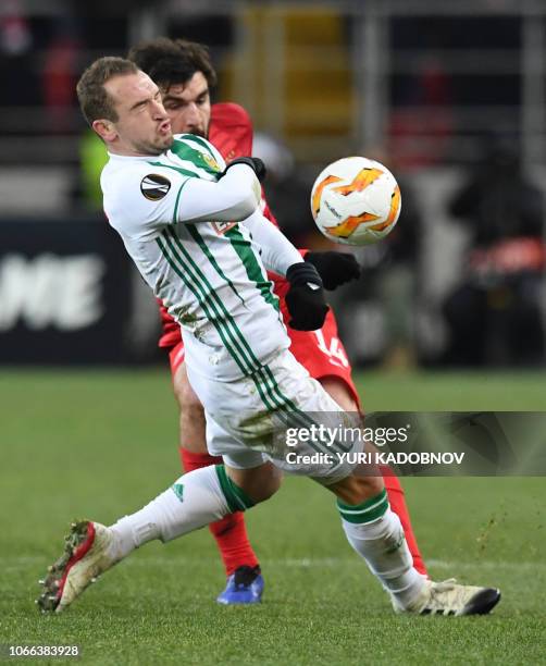 Rapid Wien's Norwegian forward Veton Berisha and Spartak Moscow's Russian defender Georgiy Dzhikiya vie for the ball during the UEFA Europa League...