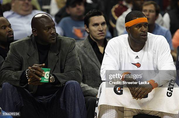 Michael Jordan, owner of the Charlotte Bobcats, sits on the bench with Stephen Jackson during their game against the San Antonio Spurs at Time Warner...