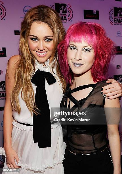 Musicians Miley Cyrus and Hayley Williams of Paramore attend the MTV Europe Music Awards 2010 at La Caja Magica on November 7, 2010 in Madrid, Spain.