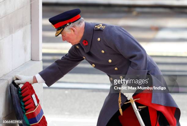 Prince Charles, Prince of Wales lays a wreath on behalf of Queen Elizabeth II during the annual Remembrance Sunday Service at The Cenotaph on...