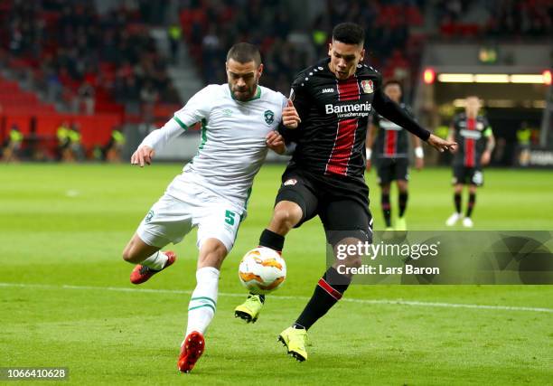 Paulo Henrique Sampaio Filho of Bayer 04 Leverkusen is challenged by Georgi Terziev of Ludogorets during the UEFA Europa League Group A match between...