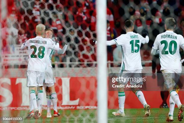 Mert Muldur of Rapid Wien and team players celebrate after a goal during UEFA Europa League Group G soccer match between Spartak Moscow and Rapid...