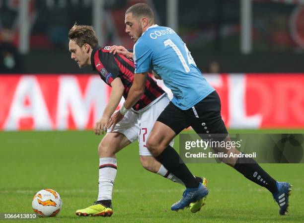 Alen Halilovic of AC Milan is challenged by Clement Couturier of F91 Dudelange during the UEFA Europa League Group F match between AC Milan and F91...