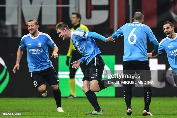 Dudelange's Luxembourgish forward David Turpel celebrates after scoring 1-2 during the UEFA Europa League group F football match AC Milan vs F91...
