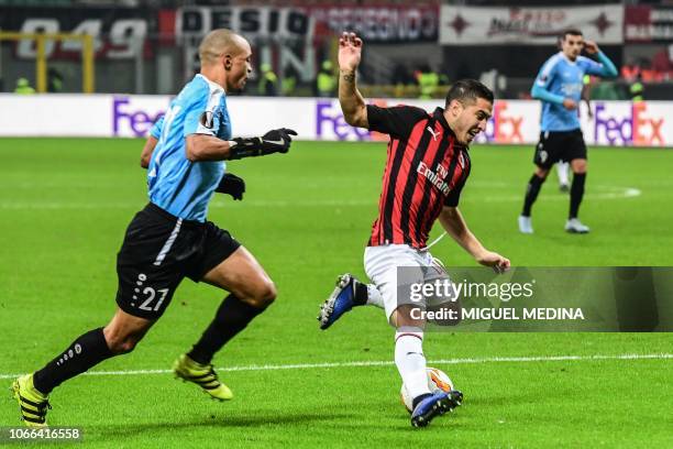 Dudelange's French defender Bryan Melisse prepares to tackle AC Milan's Italian midfielder Jose Mauri during the UEFA Europa League group F football...