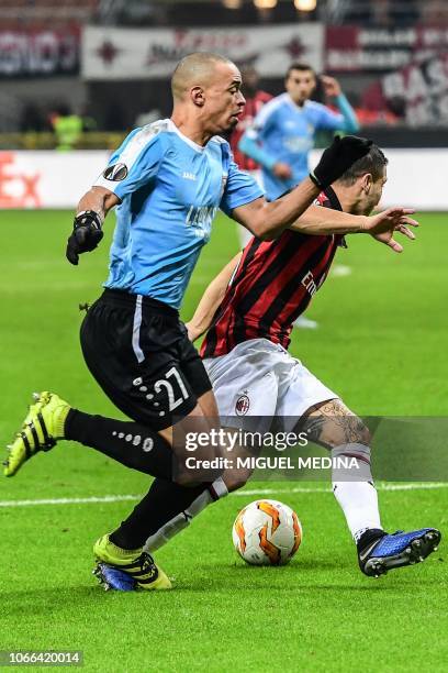 Dudelange's French defender Bryan Melisse tackles AC Milan's Italian midfielder Jose Mauri in the penalty area during the UEFA Europa League group F...