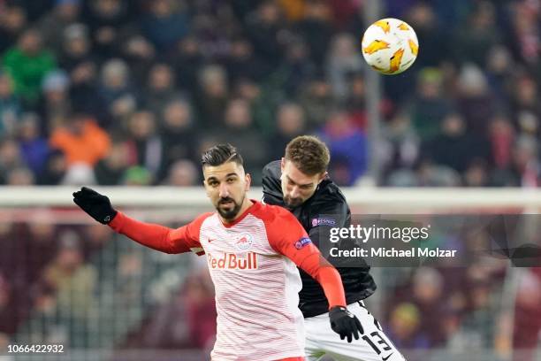 Munas Dabbur of Salzburg and Stefan Ilsanker of RB Leipzig fight for the ball during the UEFA Europa League Group B match between FC Salzburg and RB...