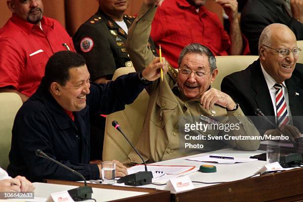 Cuban President Raul Castro Venezuelan President Hugo Chavez and Ricardo Cabrisas , Minister of the Cuban Government, share a laugh at a meeting to...