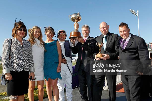 Monkey King owner Robert Famularo and driver Rickey May hold the NZ Trotting Cup after the Casino NZ Trotting Cup Day at Addington Raceway on...