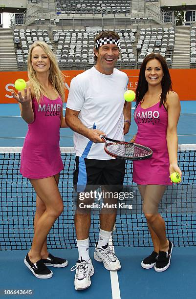 Tennis player Pat Cash of Australia poses with 'Ball Goddesses' during a media session for the upcoming Champions Downunder Tournament at Sydney...