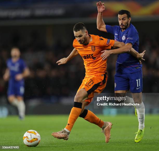 Vierinha of PAOK FC is challenged by Pedro of Chelsea during the UEFA Europa League Group L match between Chelsea and PAOK at Stamford Bridge on...