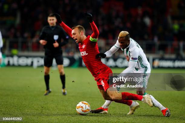 Boli Bolingoli of Rapid Wien in action against Denis Glushakov of Spartak Moscow during UEFA Europa League Group G soccer match between Spartak...