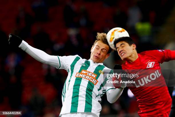 Stefan Schwab of Rapid Wien in action against Samuel Gigot of Spartak Moscow during UEFA Europa League Group G soccer match between Spartak Moscow...