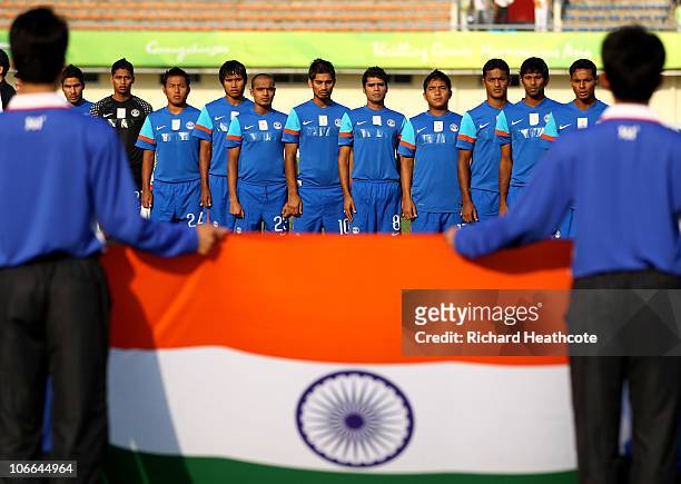 The India team sing their national anthem prior to kickoff during the Men's Football group D pool match between Qatar and India ahead of the 16th...