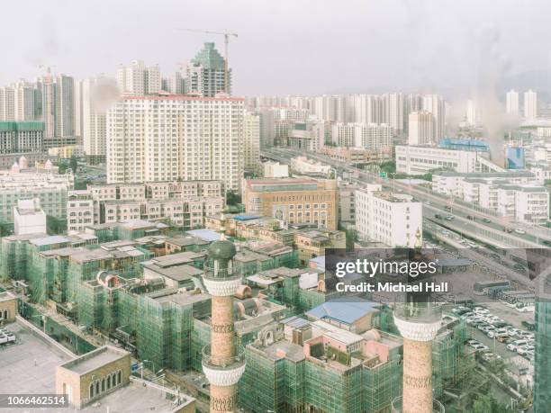 urumqi skyline - urban skyline xinjiang stock pictures, royalty-free photos & images