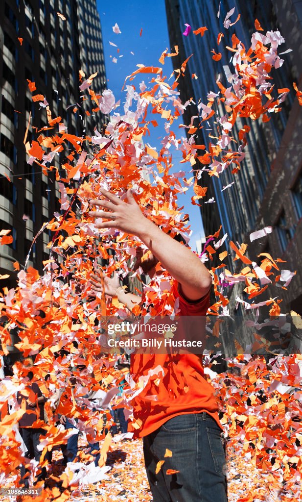 Man throwing confetti during a celebration