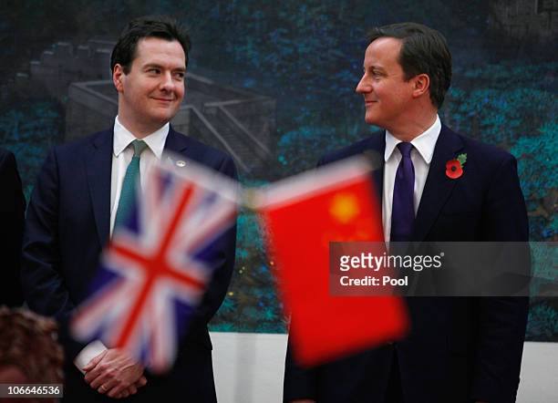 Britain's Prime Minister David Cameron and Chancellor of the Exchequer George Osborne attend a signing ceremony with China's Premier Wen Jiabao at...
