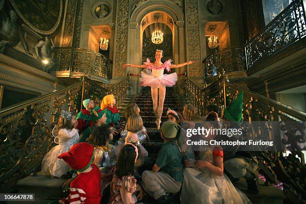 The Sugar Plum Fairy, alias Chatsworth guide Claire Fowler, entertains local school children in the painted hall of Chatsworth as the stately home's...