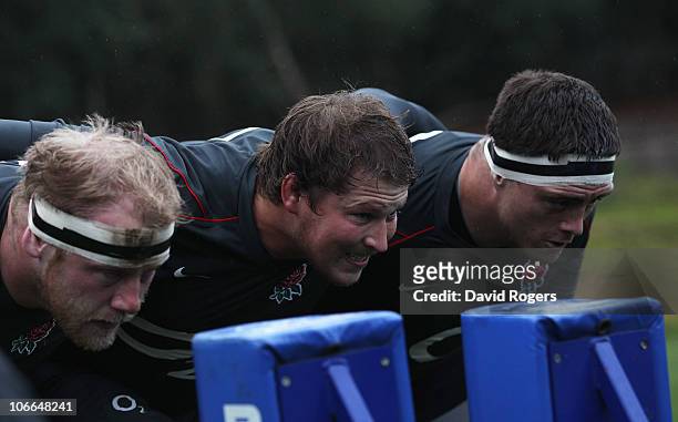 Dan Cole, Dylan Hartley and Andrew Sheridan of England practice scrummaging during an England Rugby Union training session at the Pennyhill Park...