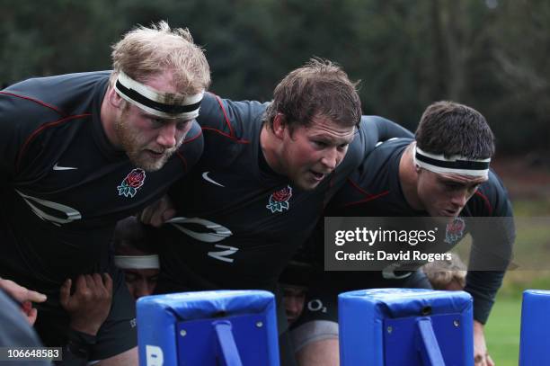 Dan Cole, Dylan Hartley and Andrew Sheridan of England practice scrummaging during an England Rugby Union training session at the Pennyhill Park...