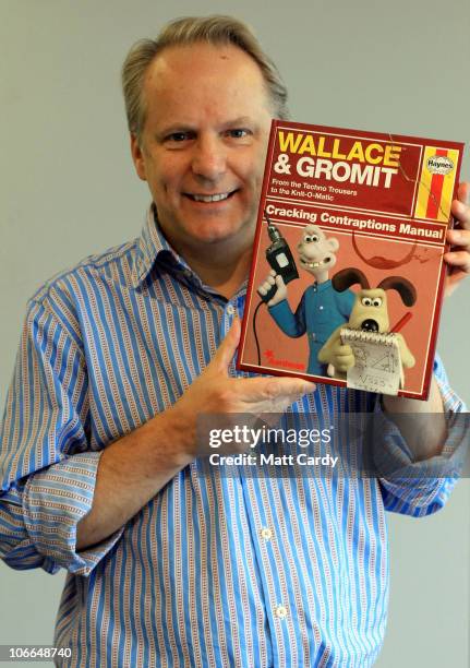 Nick Park, creator of Wallace & Gromit, holds a copy of the new Haynes 'Wallace & Gromit Cracking Contraptions' manual on November 9, 2010 in...