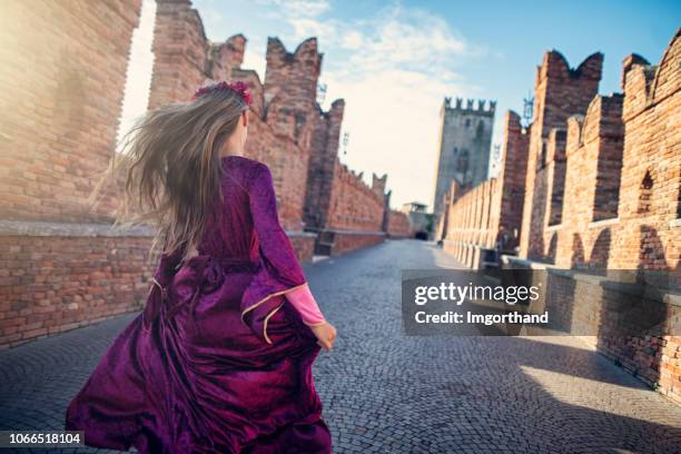 little juliet running on verona bridge - juliet capulet stock pictures, royalty-free photos & images