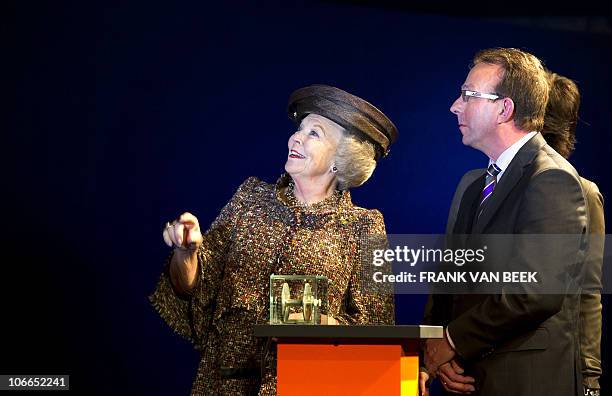 Dutch Queen Beatrix and director of Zeeland Seaports Hans van der Hart attend the official opening of the new port, the Scaldia Container Terminal of...