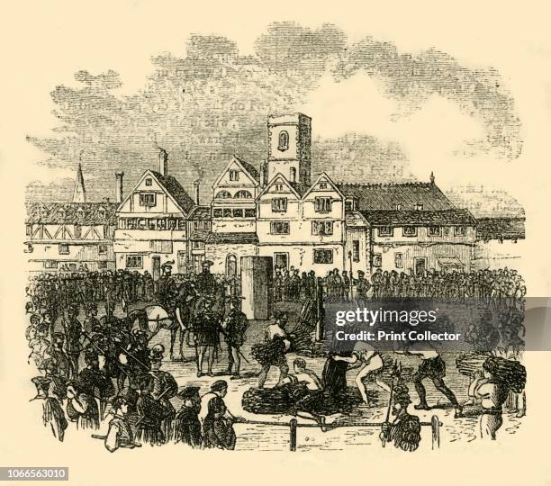 Place of Execution in Old Smithfield', . Bundles of wood being piled up for burnings at the stake. In the Middle Ages, Smithfield was a broad grassy...
