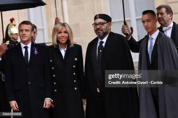 French President Emmanuel Macron and French First Lady Brigitte Macron welcome Mohammed VI is the King of Morocco and Moulay Hassan, Crown Prince of...