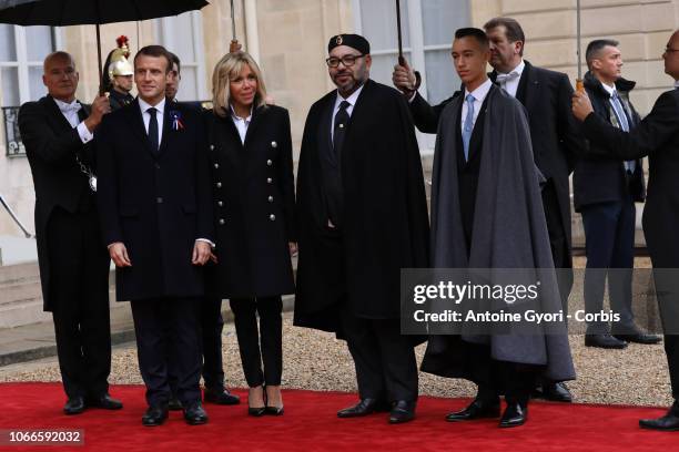 French President Emmanuel Macron and French First Lady Brigitte Macron welcome Mohammed VI is the King of Morocco and Moulay Hassan, Crown Prince of...