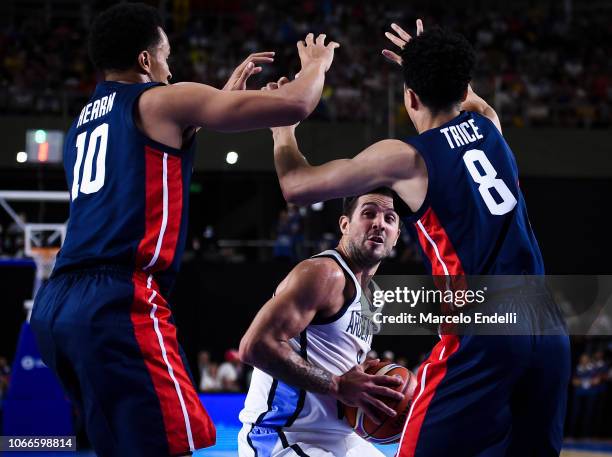 Nicolas Laprovittola of Argentina drives against Travis Trice and Reggie Hearn of USA during a match between Argentina and USA as part of FIBA...