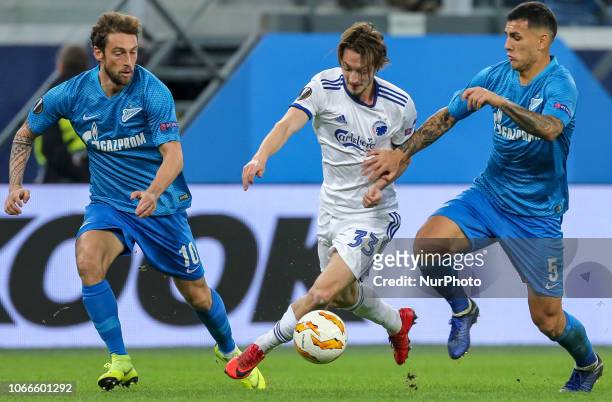 Claudio Marchisio , Leandro Paredes of FC Zenit Saint Petersburg and Rasmus Falk of FC Copenhagen vie for the ball during the Group C match of the...