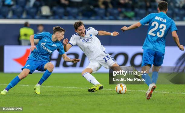 Daler Kuzyaev , Miha Mevlja of FC Zenit Saint Petersburg and Jonas Wind of FC Copenhagen vie for the ball during the Group C match of the UEFA Europa...