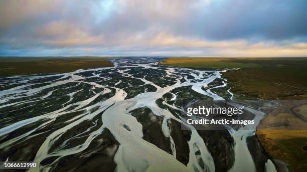 riverbeds and black sands, medallandssandur, iceland - riverbed fotografías e imágenes de stock