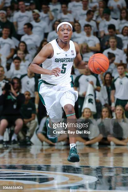 Cassius Winston of the Michigan State Spartans brings the ball up court during a game against the Florida Gulf Coast Eagles in the first half at...