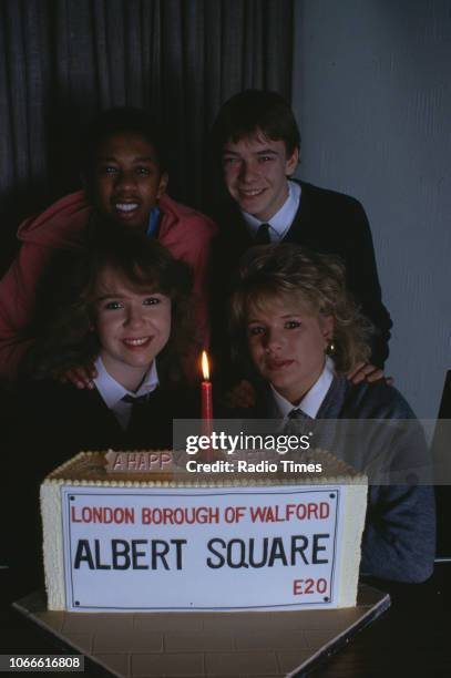 Actors Paul J Medford, Adam Woodyatt, Letitia Dean and Susan Tully pictured with a celebration cake on the set of the BBC soap opera 'EastEnders',...