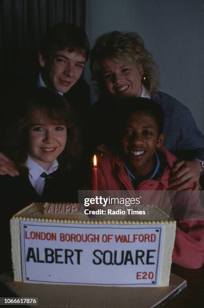Actors Paul J Medford, Adam Woodyatt, Letitia Dean and Susan Tully pictured with a celebration cake on the set of the BBC soap opera 'EastEnders',...