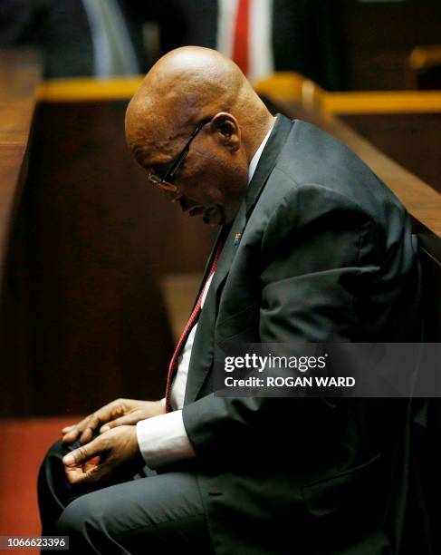 Former South African President Jacob Zuma waits ahead of his court hearing in Pietermaritzburg, on November 30, 2018. - Zuma who was forced to resign...