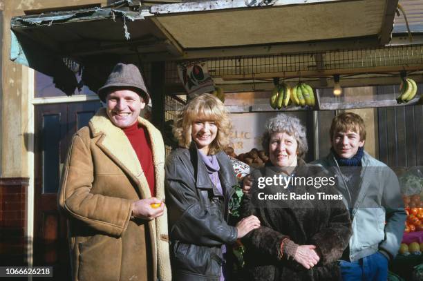 Actors Peter Dean, Gillian Taylforth, Anna Wing and Adam Woodyatt pictured on the exterior set of the BBC soap opera 'EastEnders', November 21st 1984.