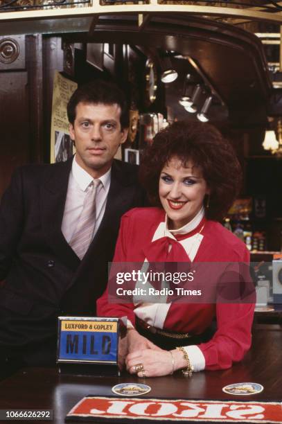 Actors Leslie Grantham and Anita Dobson pictured on the Queen Victoria pub set of the BBC soap opera 'EastEnders', December 30th 1984.